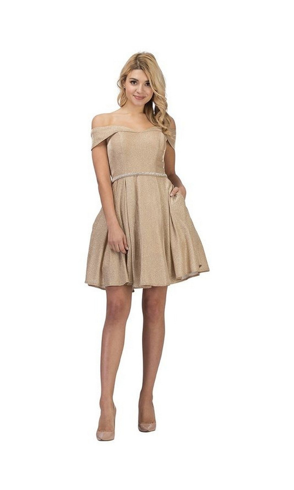 A woman wears the Short Homecoming Dress: Chicas DM4014 in Champagne Gold, featuring an off-the-shoulder neckline, fitted waist, and flared skirt that creates a graceful A-line silhouette as she stands against a plain white background.